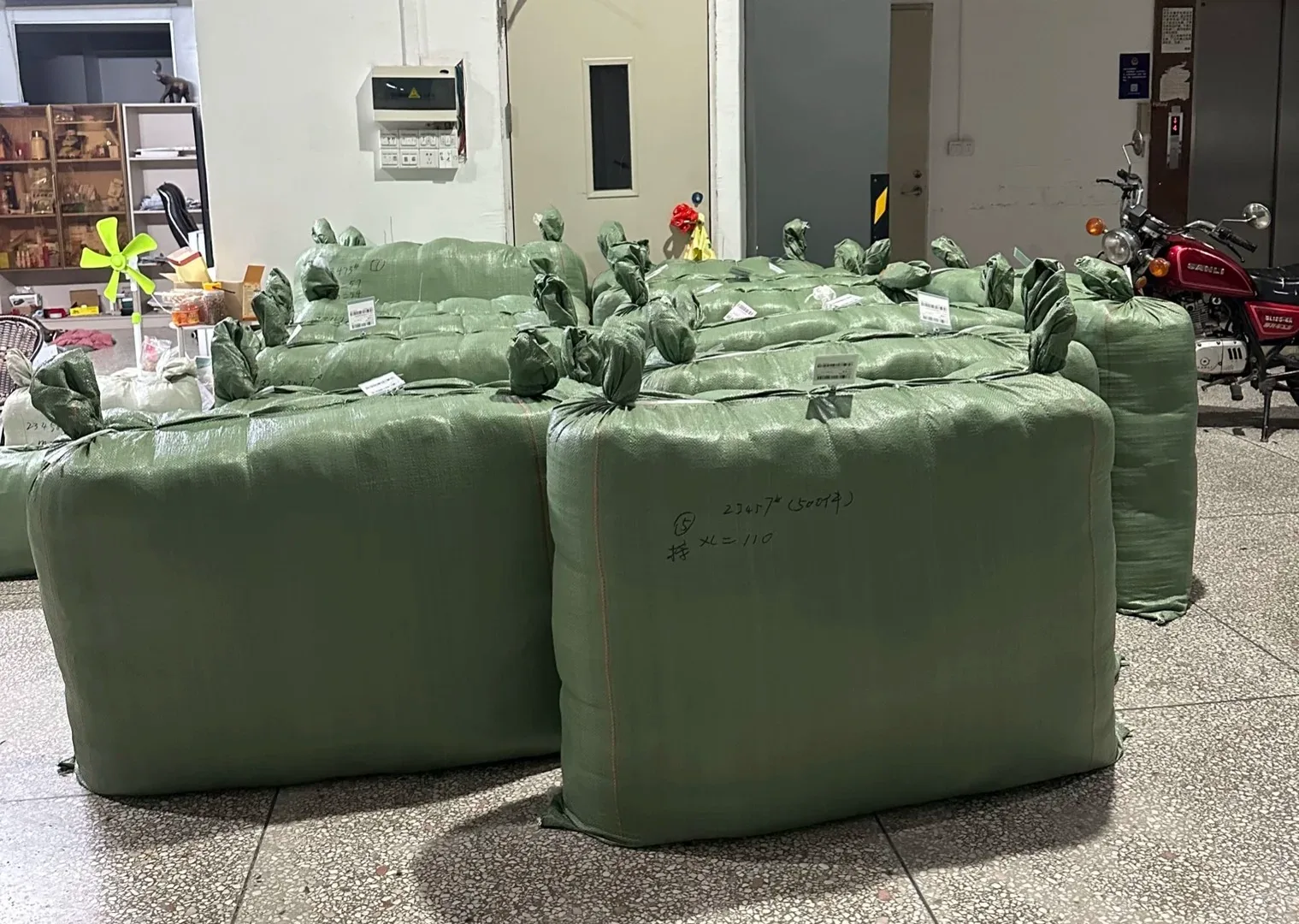 Packed garment shipments prepared for logistics collection
