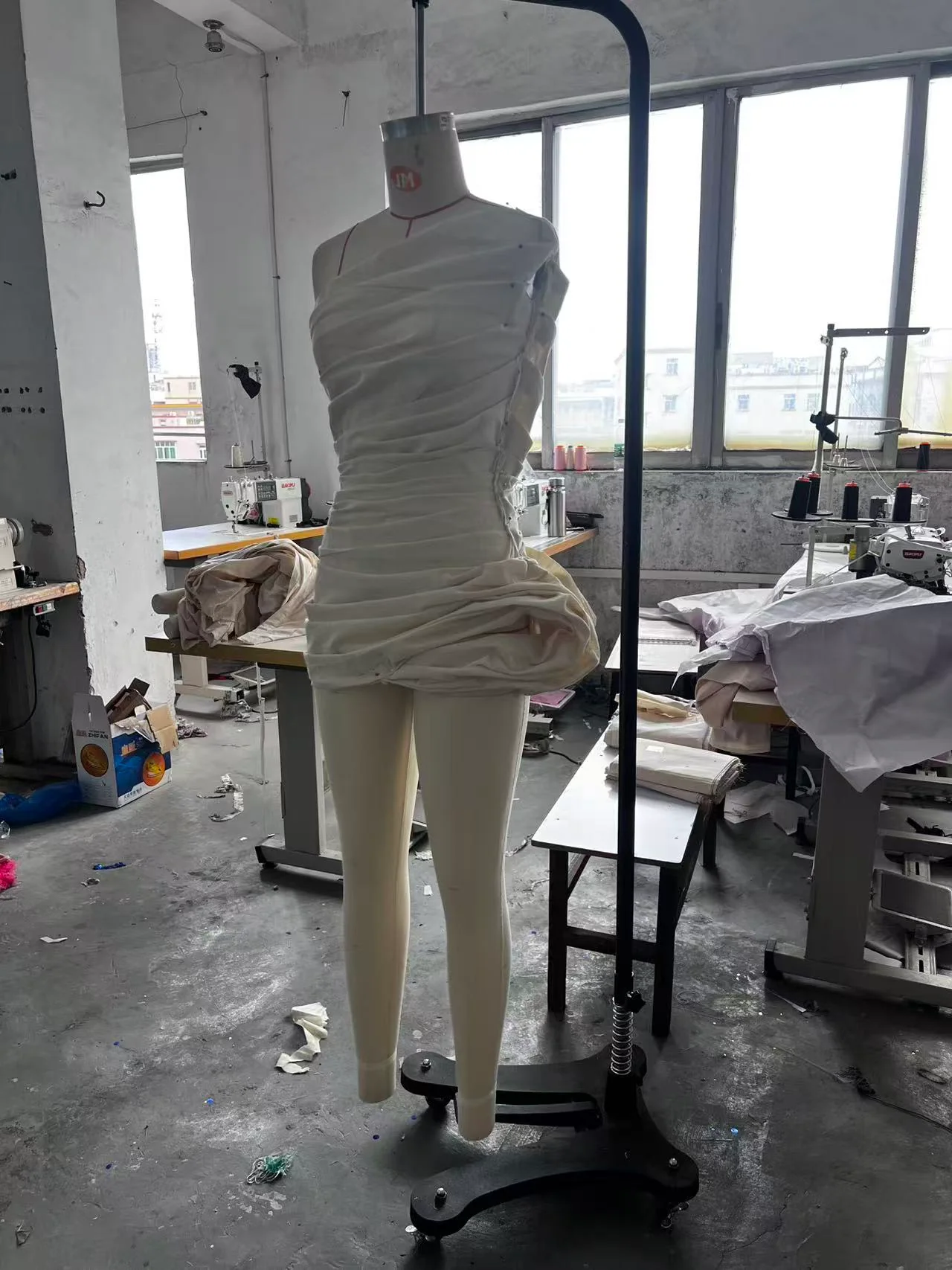 White muslin first toile viewed from the front