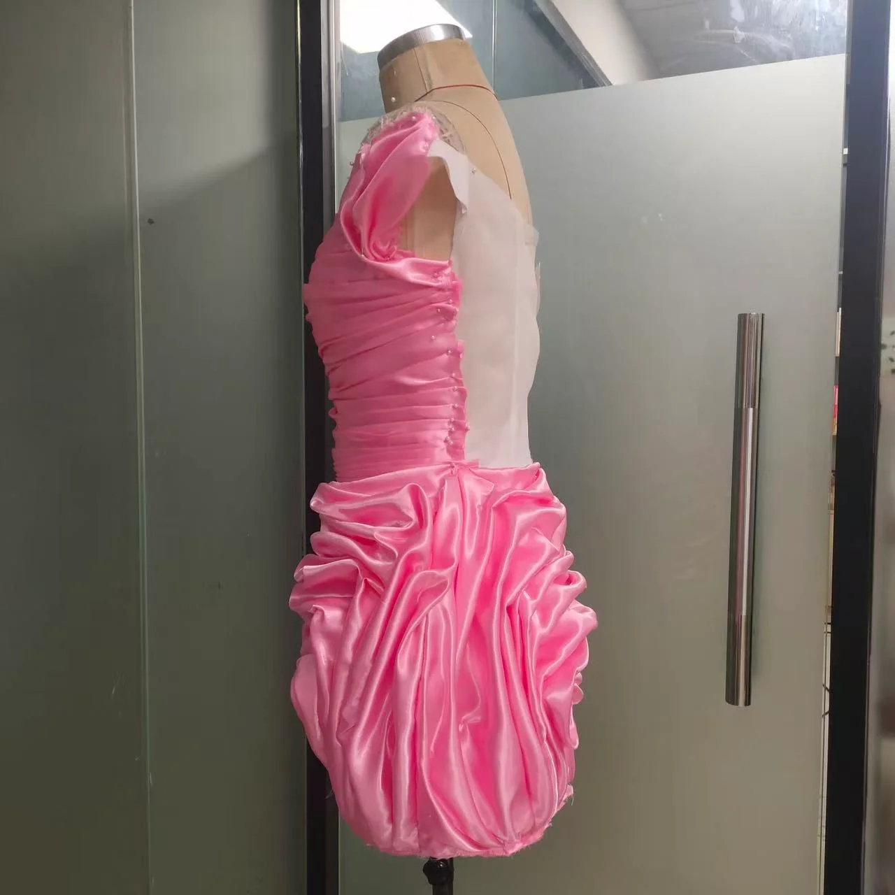 Pink revised toile viewed from a side angle