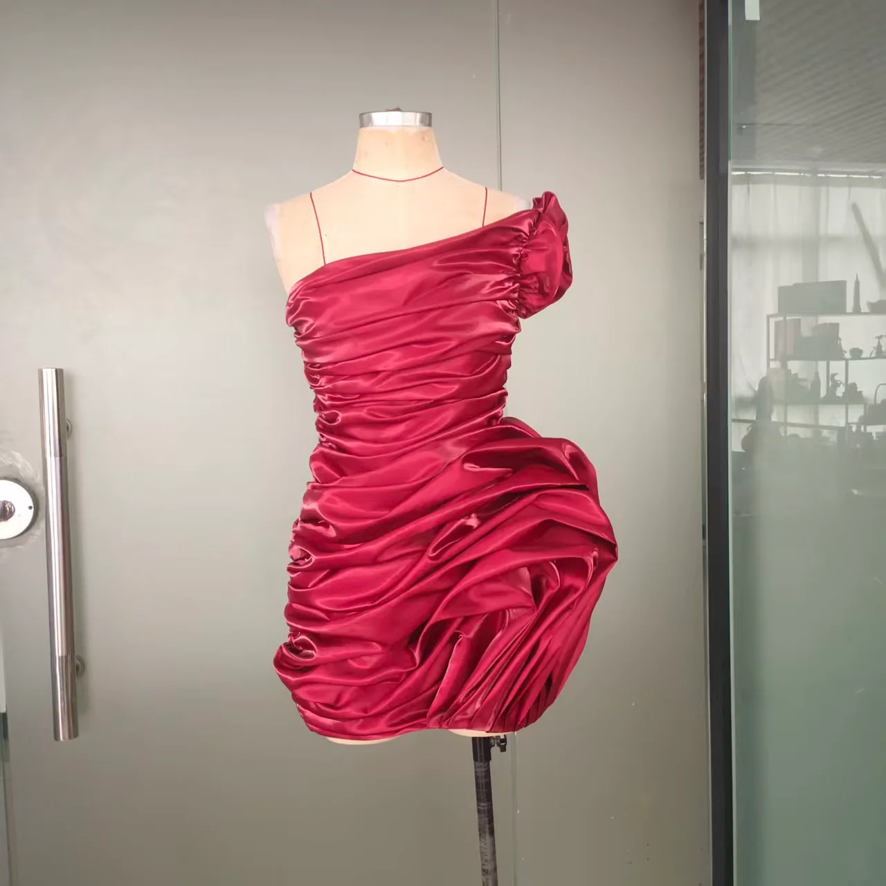 Final burgundy dress viewed at an angle